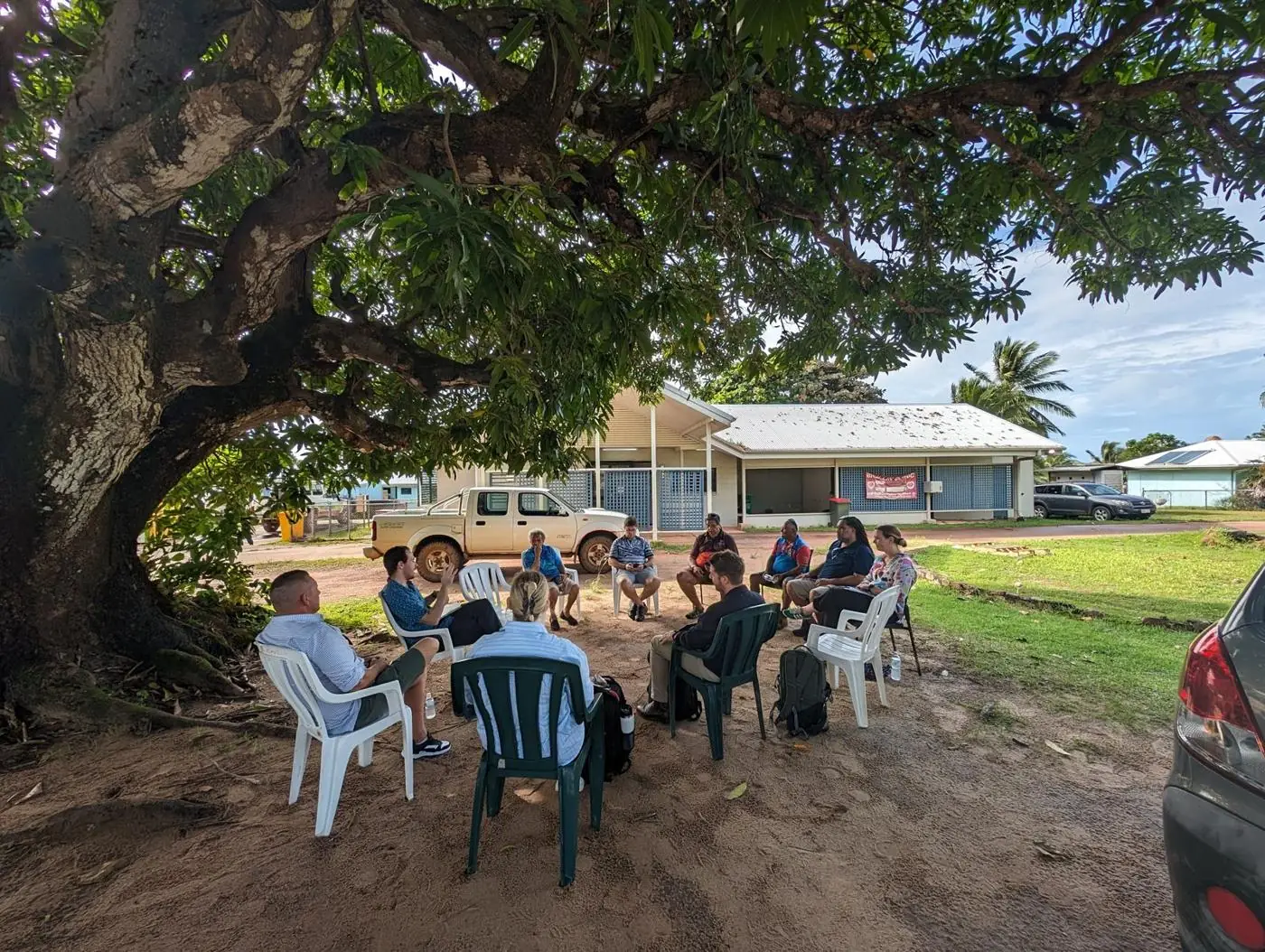 Staff consultation under a tree on Badu Island, Torres Strait